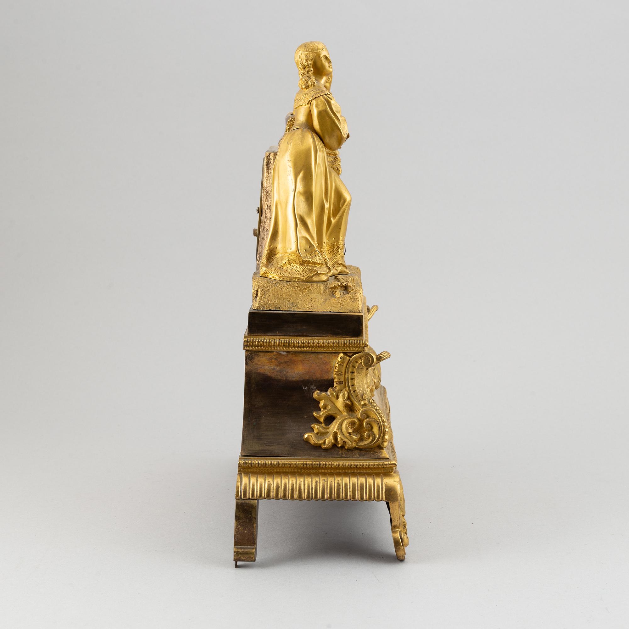 A rococo style brass mantle clock, second half of the 19th Century.