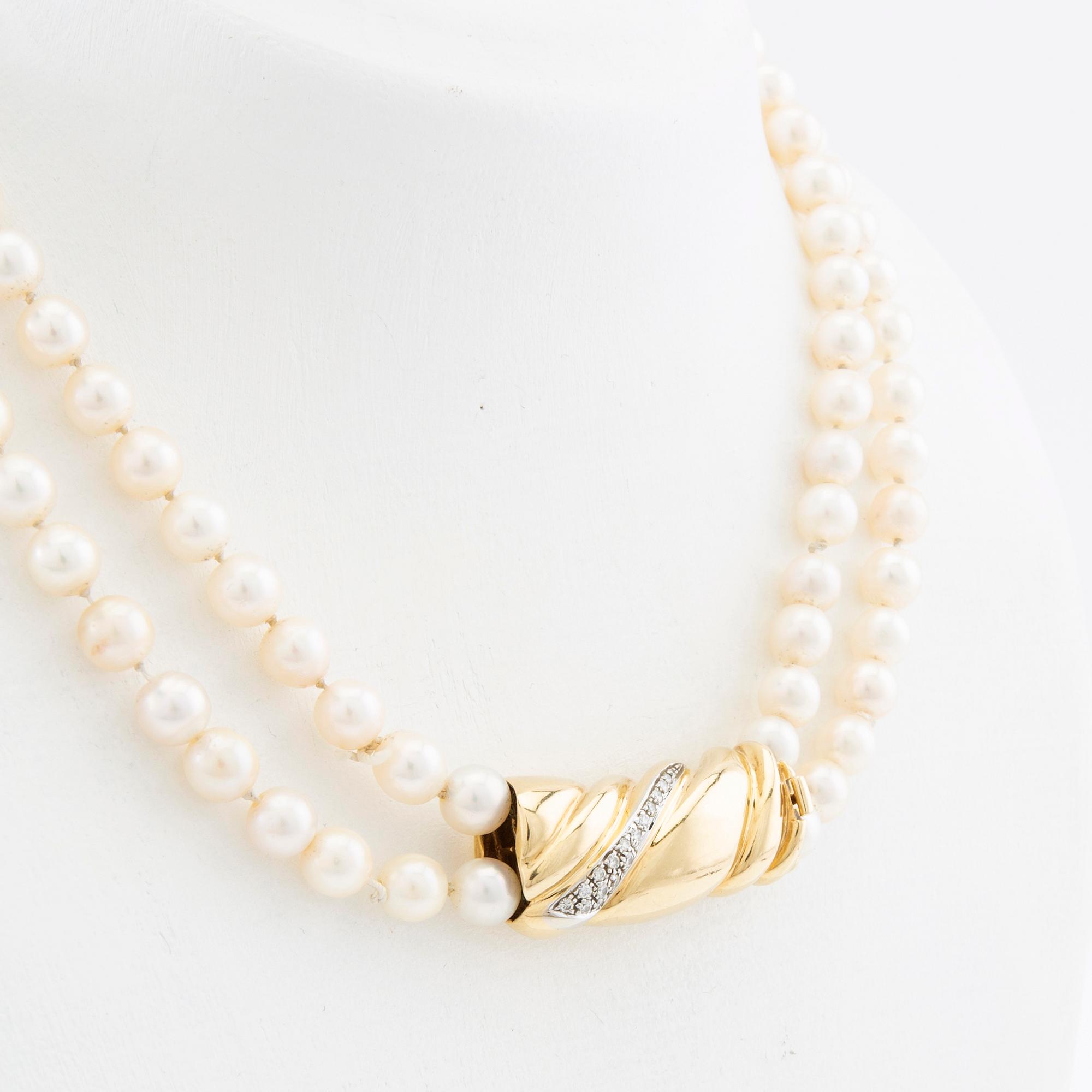 Necklace, two-stranded of cultured pearls with a clasp of 18K gold set with brilliant-cut diamonds, Damini Asolo Italy.