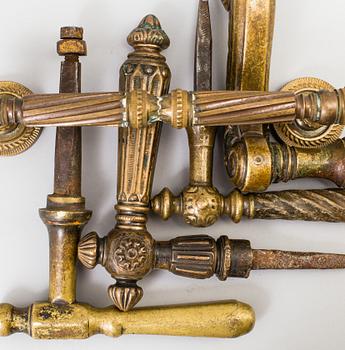 FIVE BRASS DOOR HANDLES, 19th century.