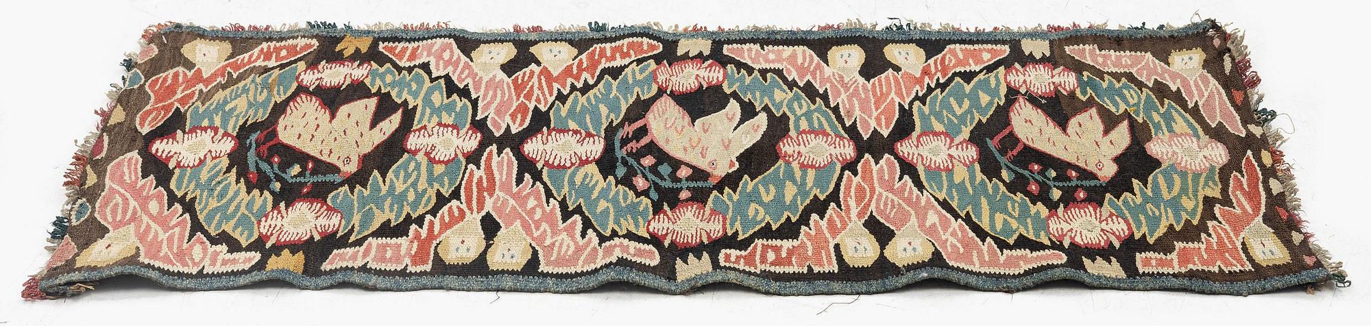 A carrige cushion, "Noaks duva" ('Noah's dove'), tapestry weave, c. 95.5 x 44 cm, Torna district, Southwestern Scania.