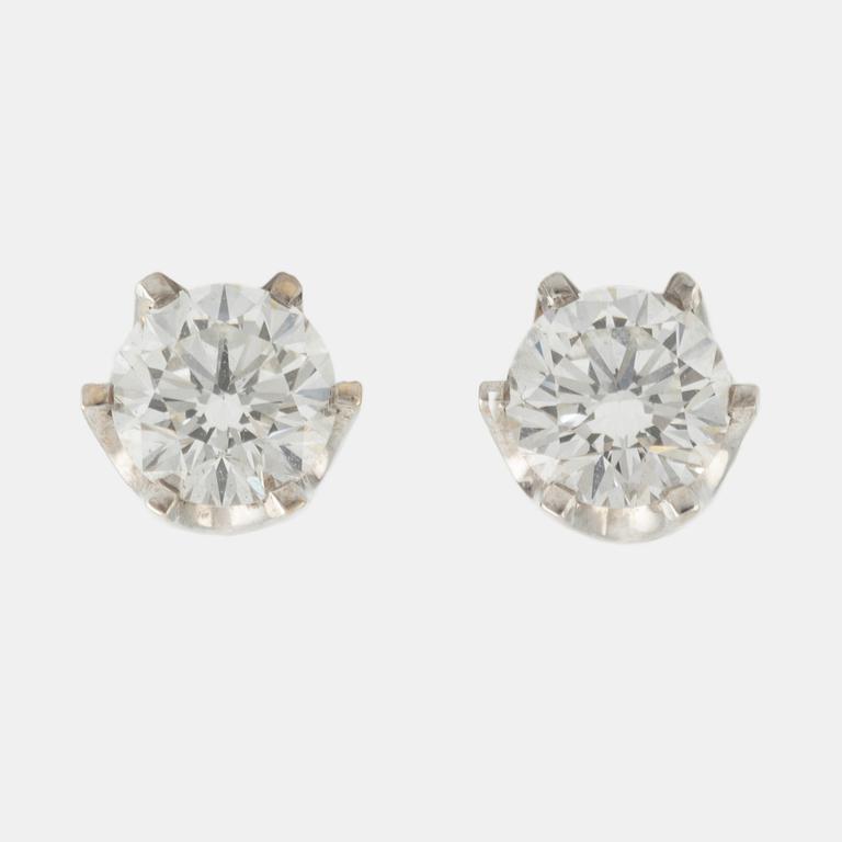 Brilliant cut diamond stud earrings.
