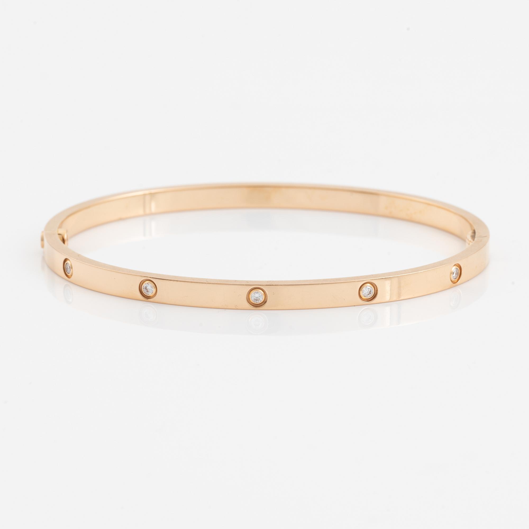 A Cartier "Love" bracelet small model in 18K rose gold with ten round brilliant-cut diamonds.