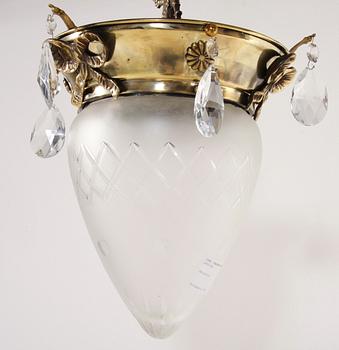TAKLAMPA. Mässing samt glas, 2000-tal.