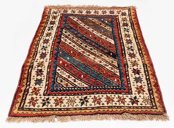 An antique Gendje rug, south Caucasus, c. 208 x 103 cm.