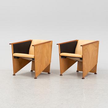 Torbjörn Ahlström, a pair of mahogany and cherry armchairs.