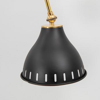 A bras wall lamp later part of the 20th century.