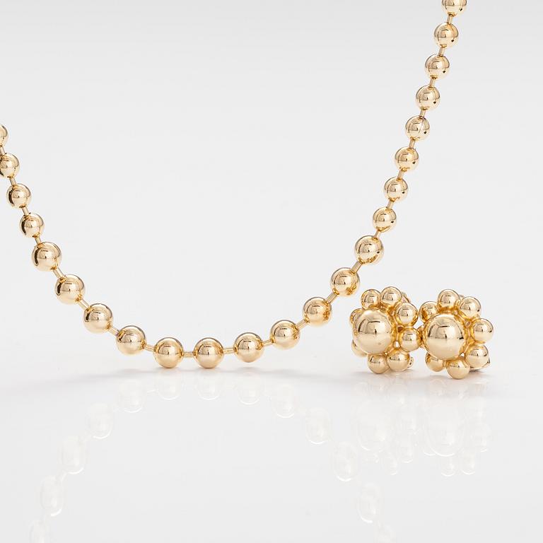 DIOR. A necklace and a pair of earrings in gold coloured metal. Marked Chr. Dior, Germany.