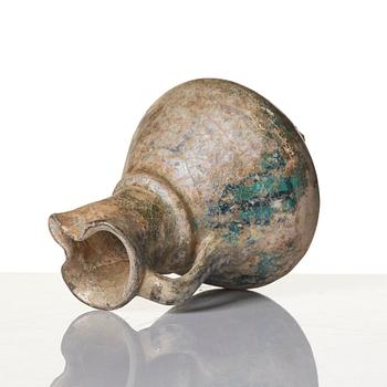 A turquoise-glazed Keshan jug, Persian, 13th century.
