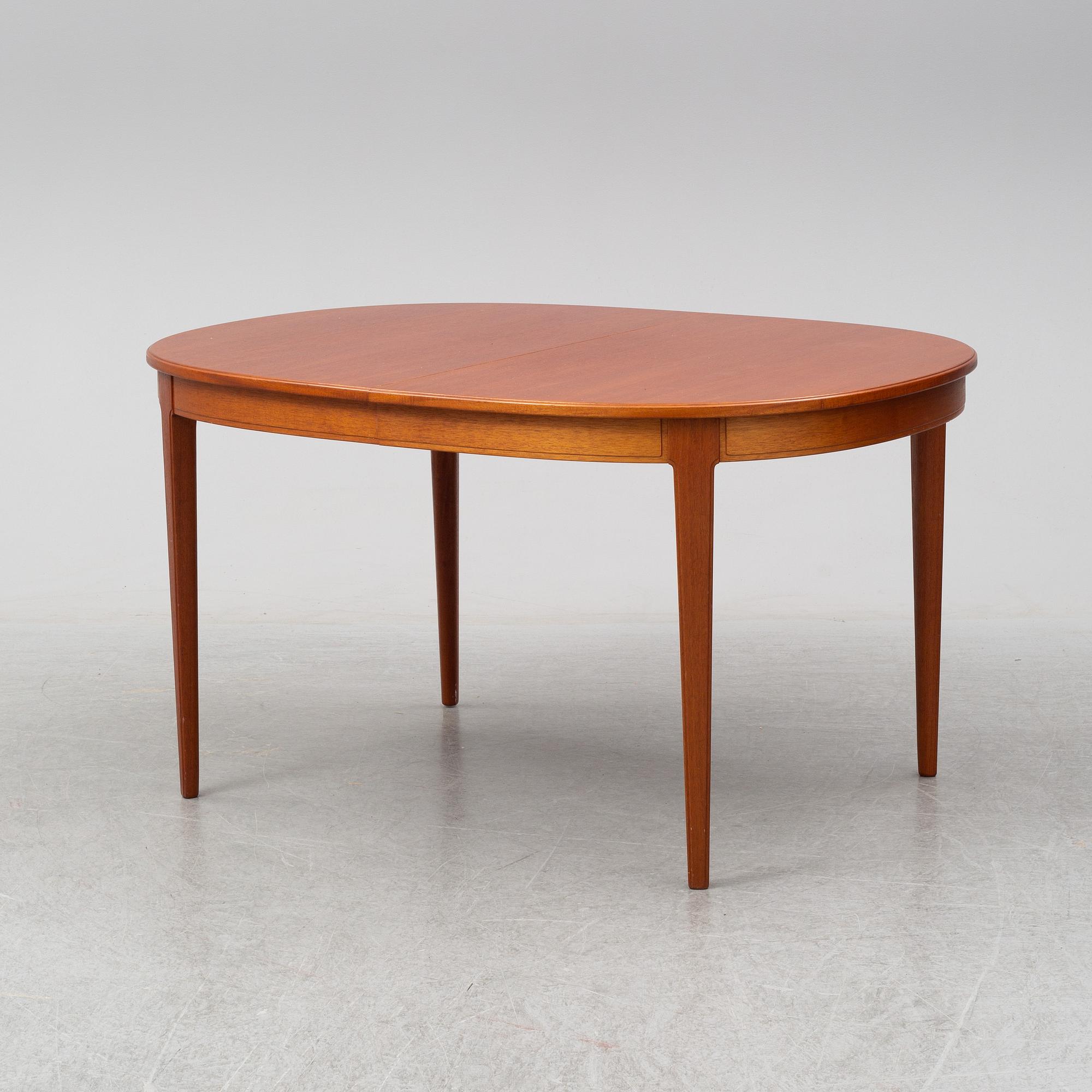 CARL MALMSTEN, A 'Herrgården' table with six chairs and two leaves.