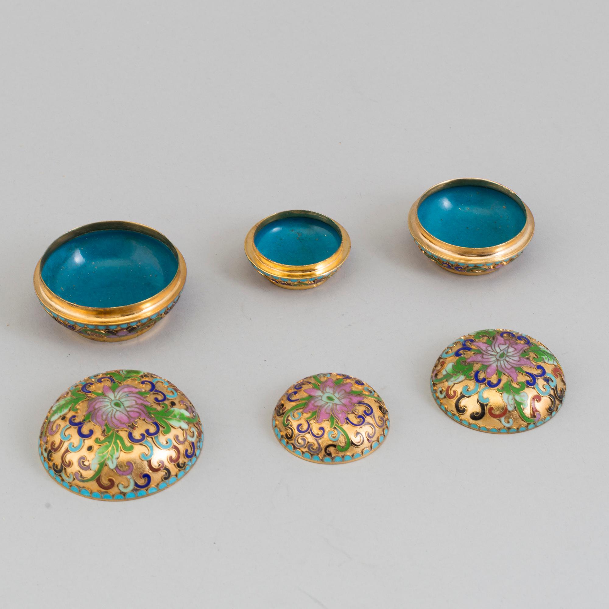 Three small boxes, two eggs and a bell, enamel, probably China, second half of th 20th century.