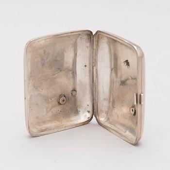 A silver case, Nikolai Kemper, and a pen and a paper knife in silver and enamel, import marks St Petersburg early 1900s.
