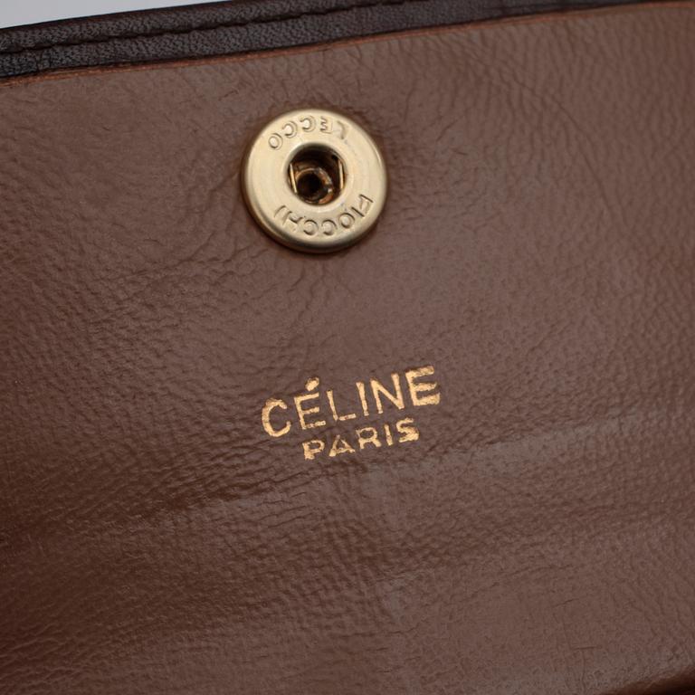 CÉLINE, a brown leather clutch bag and purse.