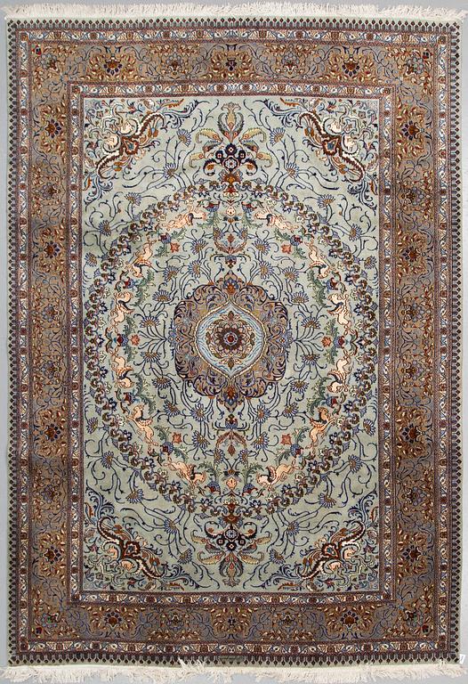 A CARPET, Kashmar, part silk, signed Mosafar Khan, around 344 X 241.