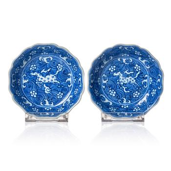 834. A pair of blue and white lobed dishes with flying horses, Qing dynasty, Kangxi (1662-1722).