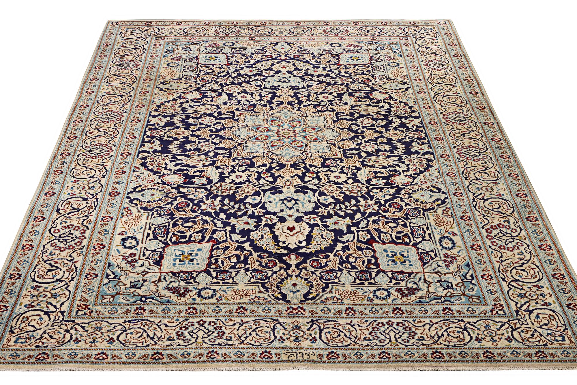 A Nain carpet, part silk, 9 laa, c. 338 x 244 cm.