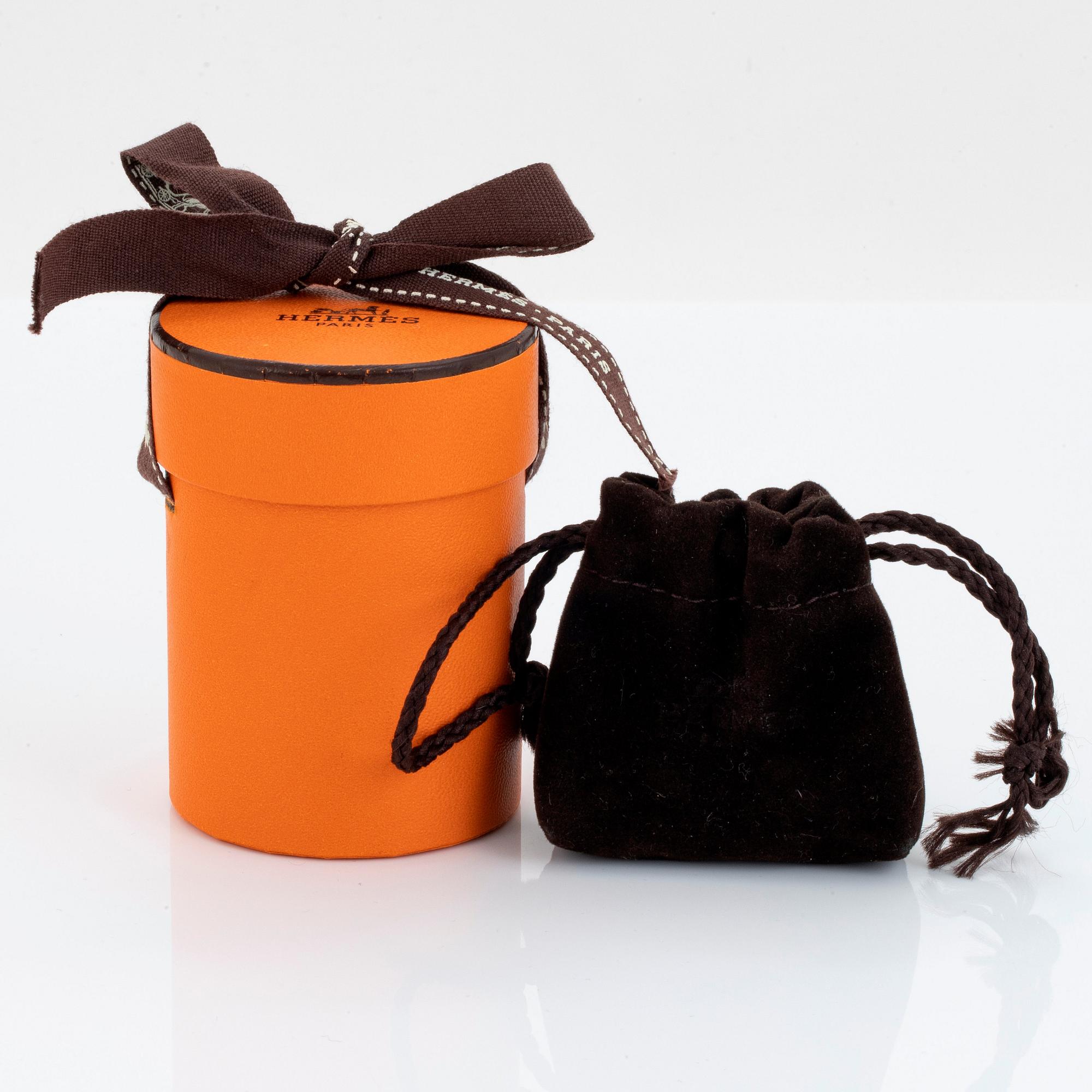 Hermès nyckelring i form av en uggla 18K guld med rubiner.