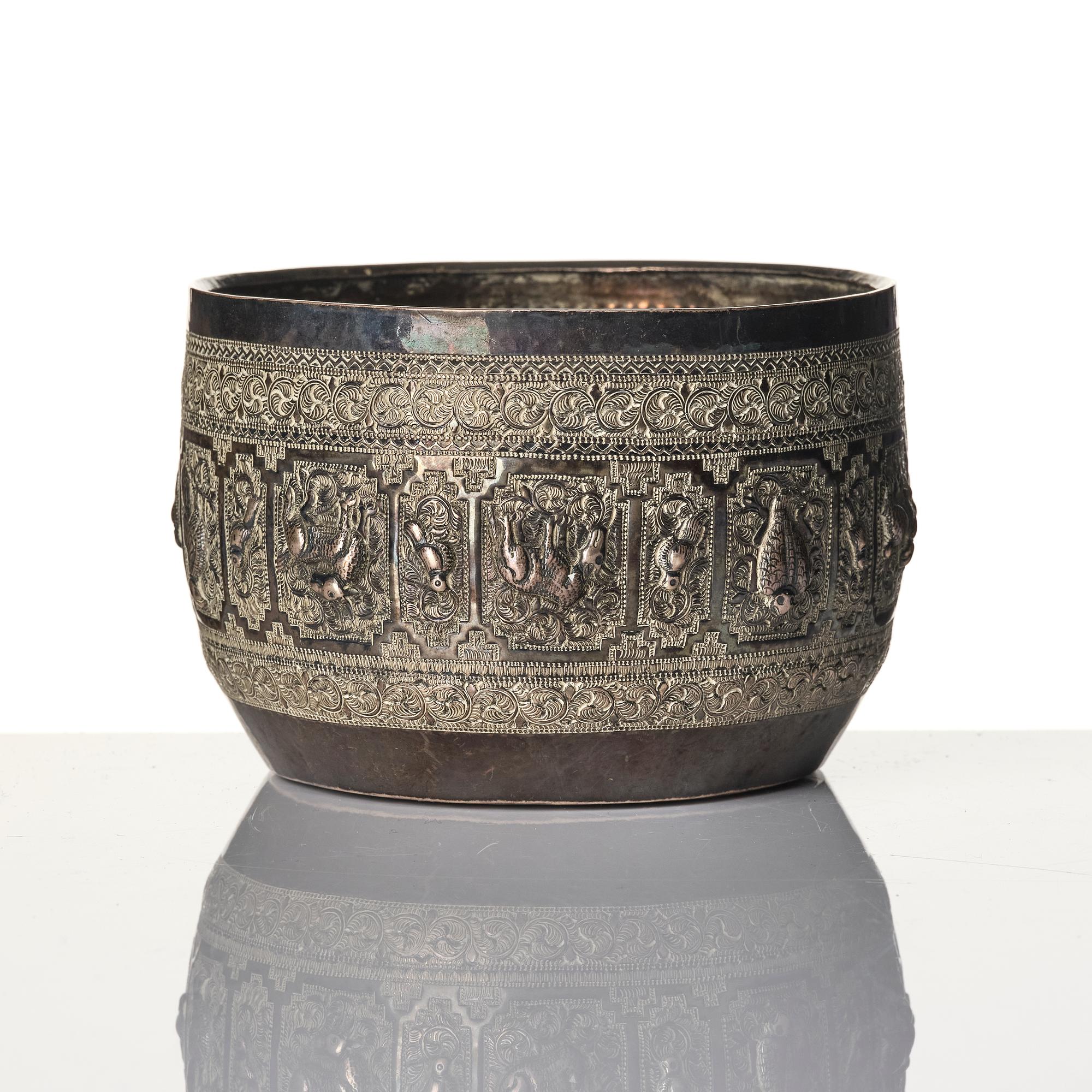 A Chinese brushpot, Qing dynasty, circa 1900. An archaistic bronze ewer and a silvered South East Asian bowl with stand.