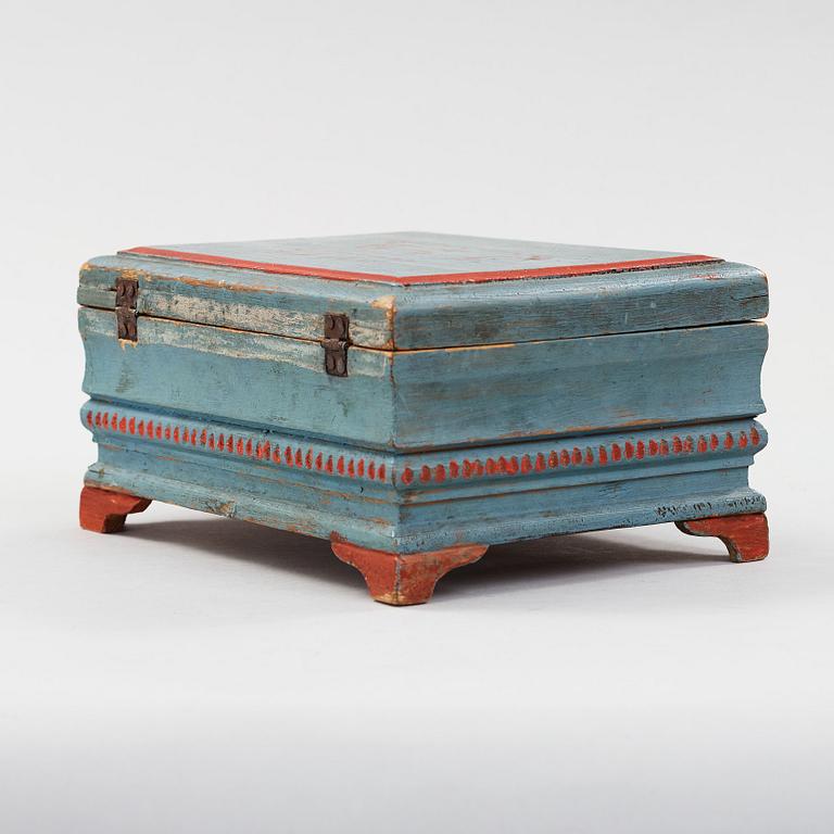 a wooden box marked JJD 1814.