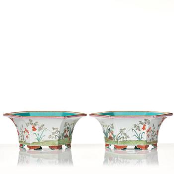 A pair of famille rose flower pots with stands, probably Republic, China, 20th Century.