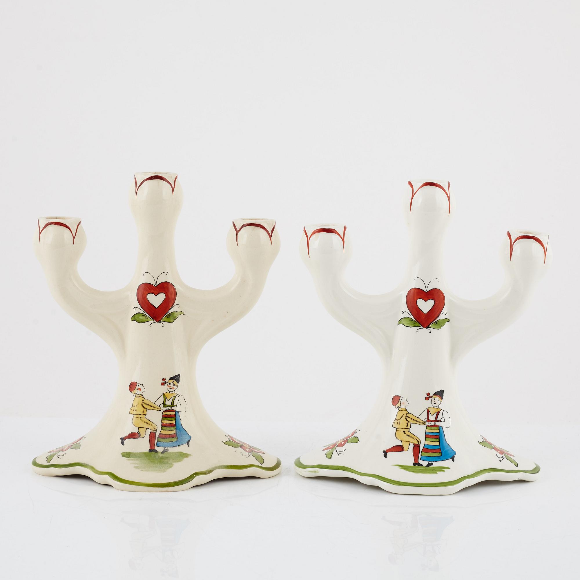 A pair of 'Daladansen' creamware candelabra from Rörstrand, Art Nouveau, early 20th Century.