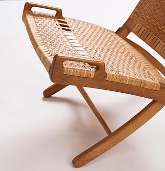 Hans J. Wegner, a pair of oak and rattan folding chairs 'JH-512', Johannes Hansen, Denmark 1950-60s.