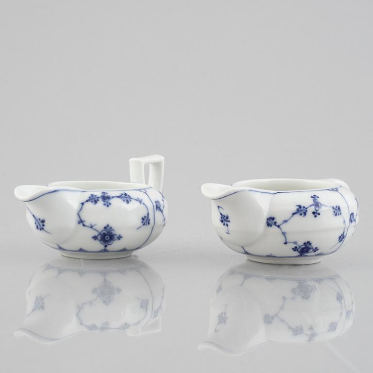 Two 'Musselmalet' porcelain creamers, Royal Copenhagen, one model 55, 19th century.