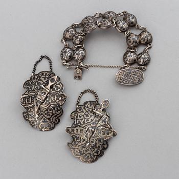 A Russian silver and niello bracelet and two belt buckles, unidentified makers mark, Kiev 1896-1908 and other.