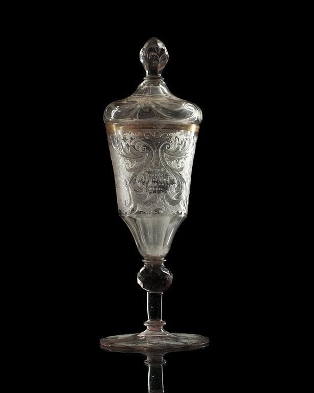 A German cut and engraved glass goblet with cover, 18th Century.
