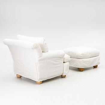 An armchair with ottoman, contemporary.