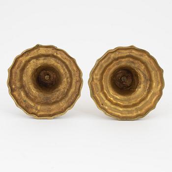 A pair of French brass candles sticks, 19th Century.