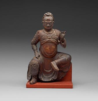 A gilt wooden figure of a deity, Ming dynasty.