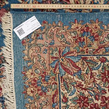 A semi-antique Kerman carpet,  440 x 296 cm.