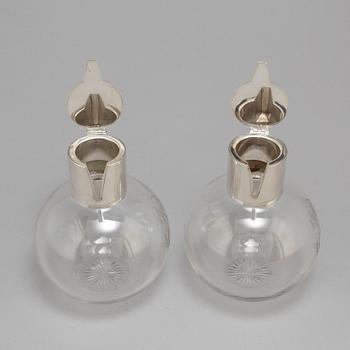 A pair of caraffes with silver mountings by CG Hallberg, Stockholm 1890.