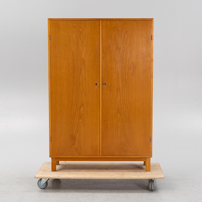An oak veneered cabinet. 20th Century.