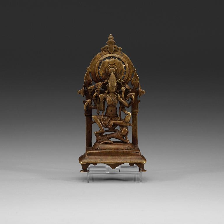 A seated bronze figure of a deity, Himachal Pradesh, presumably 12th Century.