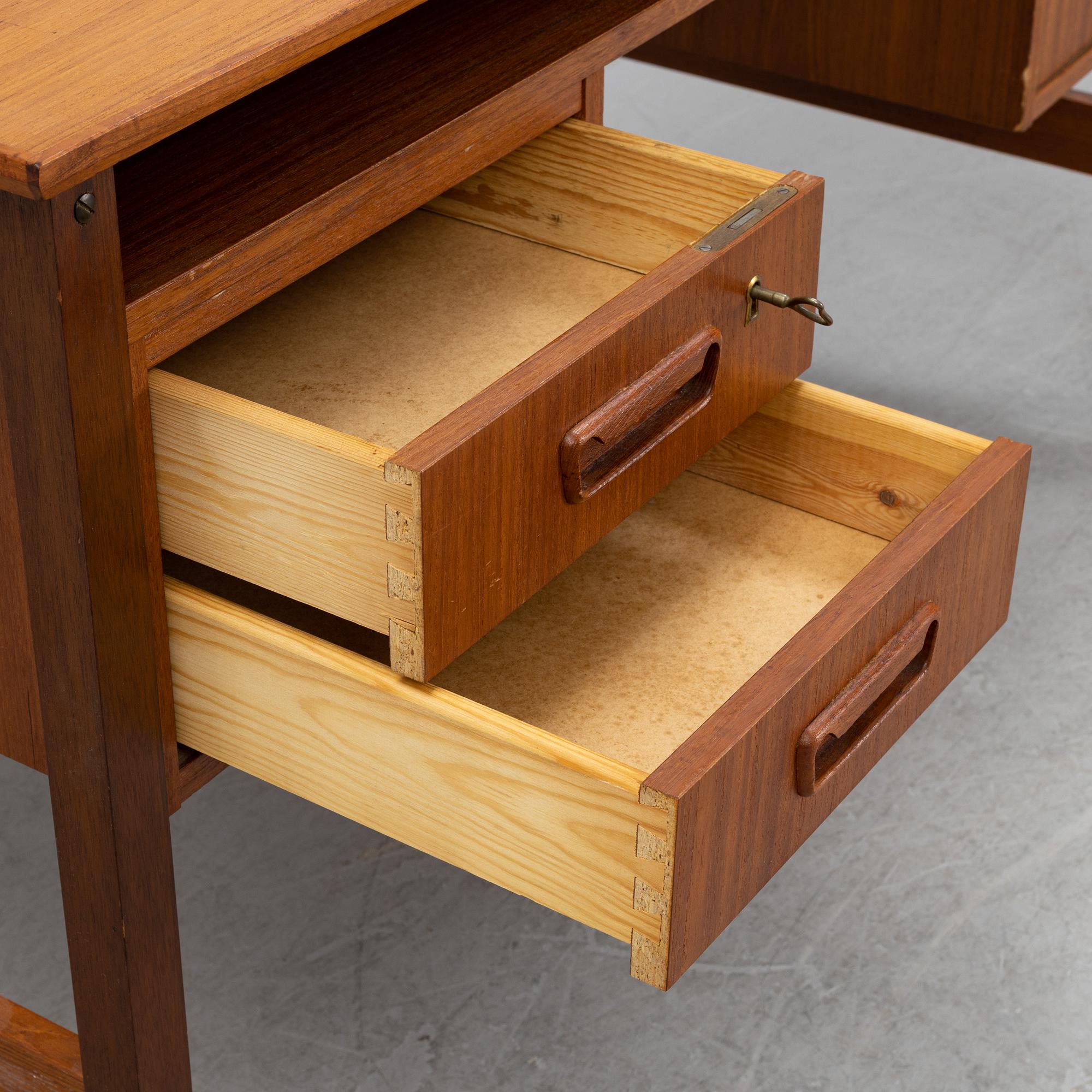 A 1960's teak writing desk.