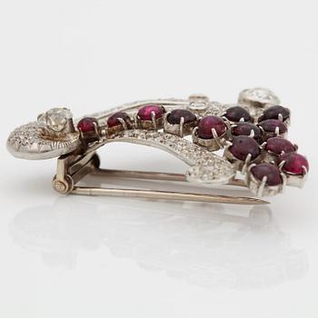 A brooch set with old-cut diamonds with a total weight of ca 2.50 cts and cabochon-cut rubies.