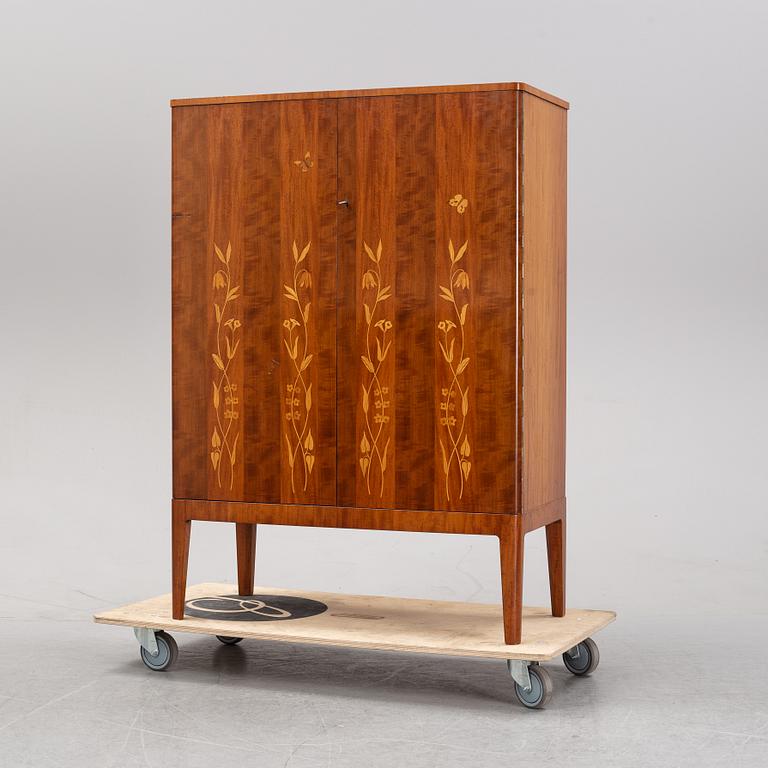 A 1940's Swedish Modern mahogany cabinet from Möbelbolaget.