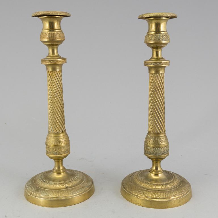 A pair of 'Empire' candlesticks, probably French.