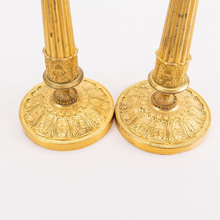 A pair of Empire brass candle sticks mid 1800s.