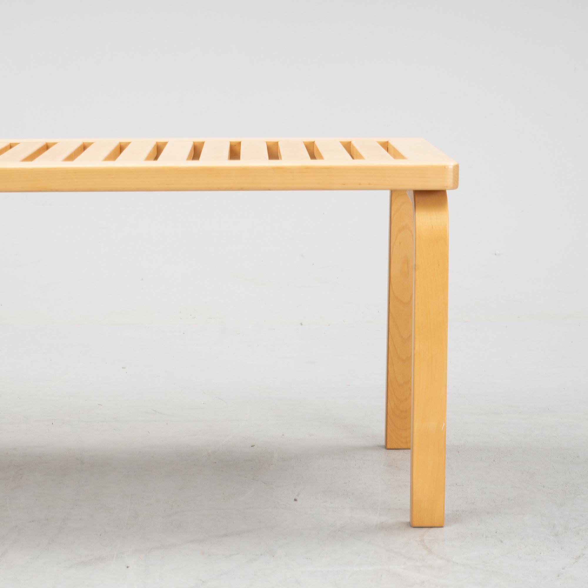 A bench and a stool by Alvar Aalto, from around the year 2000.