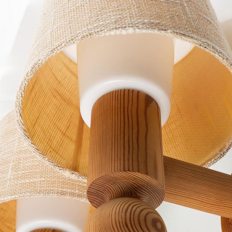 Uno & Östen Kristansson, a pair of pine wall lamps, Luxus, 1970s.