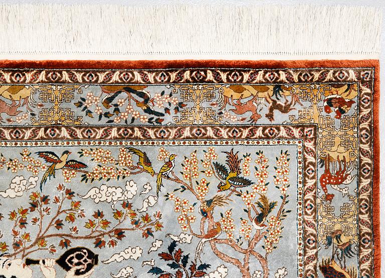 A pictorial oriental silk rug, ca 156 x 93 cm.