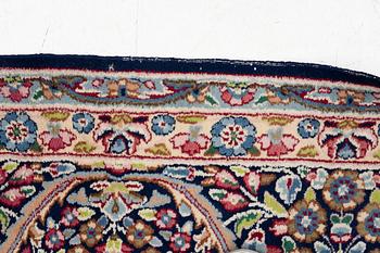 An oriental carpet, c. 385 x 300 cm.