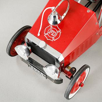 A child´s pedal car from the fourth quarter of the 20th century.