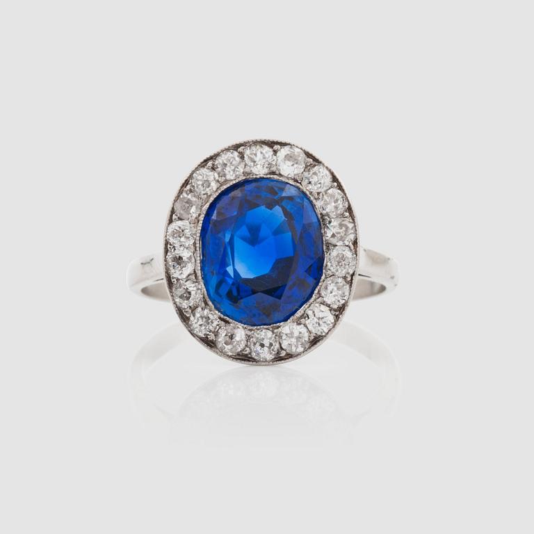 An untreated sapphire, 4.48 cts and brilliant-cut diamonds, circa 0.75 ct in total, ring.