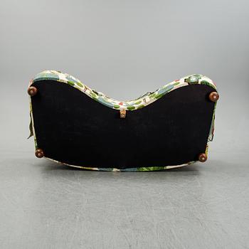 A model 968 sofa by Josef Frank for Firma Svenskt Tenn.