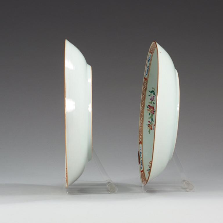 A pair of famille rose 'double peacock' dishes, Qing dynasty, Qianlong (1736-95).