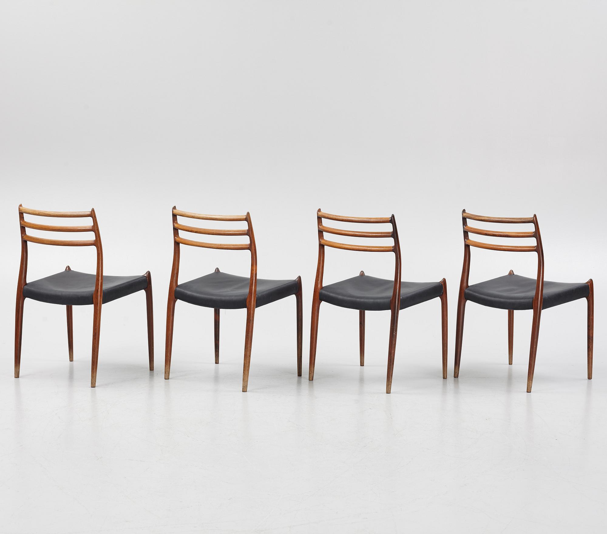 Niles Otto Møller, a rosewood veneered table with four chairs, JL Møller, Denmark, 1950's/60's.