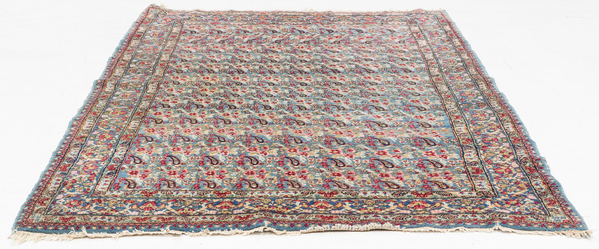 A Persian rug, c. 220 x 140 cm.